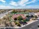 Charming single-story home with desert landscaping, a red tile roof and an attached garage at 18400 N Deer Grass Ct, Surprise, AZ 85374