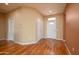 Entry Foyer with hardwood floors, two doors, and natural light at 18400 N Deer Grass Ct, Surprise, AZ 85374