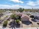 Beautiful desert home featuring a lush landscape, charming curb appeal and tile roof at 18400 N Deer Grass Ct, Surprise, AZ 85374