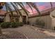 Inviting desert home featuring desert landscaping, a tile walkway, and warm exterior lighting at 18400 N Deer Grass Ct, Surprise, AZ 85374