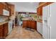 Functional kitchen with a stove, a dishwasher, and cabinets for storage at 18400 N Deer Grass Ct, Surprise, AZ 85374