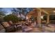 Relaxing outdoor patio with lounge seating and a pergola, perfect for entertaining at 18400 N Deer Grass Ct, Surprise, AZ 85374