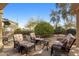 Relaxing outdoor patio seating with comfortable wicker chairs and desert landscaping at 18400 N Deer Grass Ct, Surprise, AZ 85374