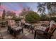 Relaxing patio area featuring comfortable lounge furniture and desert landscaping at 18400 N Deer Grass Ct, Surprise, AZ 85374