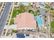 Aerial view of a backyard featuring a pool, putting green, landscaped yard, and covered patio at 20618 W Western Dr, Buckeye, AZ 85396