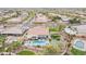 Overview of a home and community showcasing a pool, manicured lawn, and putting green in the backyard at 20618 W Western Dr, Buckeye, AZ 85396