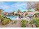 Backyard with a pool, hot tub, fire pit, and seating area offers a relaxing outdoor retreat at 20618 W Western Dr, Buckeye, AZ 85396