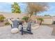 Backyard with a hot tub, fire pit, and seating offers relaxation and entertainment in a private setting at 20618 W Western Dr, Buckeye, AZ 85396