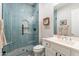 Updated bathroom with glass shower enclosure, tiled shower with niche, and modern vanity creates a luxurious experience at 20618 W Western Dr, Buckeye, AZ 85396