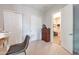 Bedroom featuring closet, dresser, and view to hall with wood floors, creating a comfortable and functional space at 20618 W Western Dr, Buckeye, AZ 85396