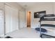 Light and airy exercise room with large closets, carpet floors, and a door that opens to the hallway at 20618 W Western Dr, Buckeye, AZ 85396