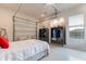 Garage Bedroom with garage door, gray wardrobe, and light floors at 20618 W Western Dr, Buckeye, AZ 85396