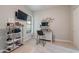 Home office featuring work space, stylish shelving, and natural light is ideal for remote work or study at 20618 W Western Dr, Buckeye, AZ 85396