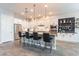 Bright kitchen features a large island with seating, white cabinets, modern appliances, and stylish decor at 20618 W Western Dr, Buckeye, AZ 85396