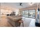 Bright and airy living room showcases a seamless connection to the modern kitchen and outdoor living space at 20618 W Western Dr, Buckeye, AZ 85396
