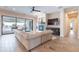 Bright living room features a large sliding glass door, access to the pool area, and a fireplace at 20618 W Western Dr, Buckeye, AZ 85396