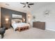 Spacious main bedroom boasts a large bed, stylish decor, and plenty of natural light at 20618 W Western Dr, Buckeye, AZ 85396