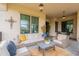 Inviting covered patio with stylish outdoor furniture, perfect for relaxing and entertaining guests at 20618 W Western Dr, Buckeye, AZ 85396