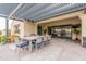 Covered patio features a dining set, offering a comfortable space for outdoor gatherings and relaxation at 20618 W Western Dr, Buckeye, AZ 85396