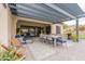 Inviting covered patio with stylish furniture, dining area, and seamless indoor-outdoor flow at 20618 W Western Dr, Buckeye, AZ 85396