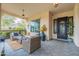 Inviting covered patio with stylish outdoor furniture, perfect for relaxing and entertaining guests at 20618 W Western Dr, Buckeye, AZ 85396