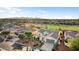 Aerial view of a home in a well-planned community with golf course at 22416 N Arrellaga Dr, Sun City West, AZ 85375