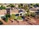 Home with backyard patios surrounded by mature palm trees and desert landscaping at 22416 N Arrellaga Dr, Sun City West, AZ 85375