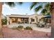 Backyard patio with outdoor seating and desert landscaping at 22416 N Arrellaga Dr, Sun City West, AZ 85375