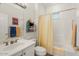 Clean bathroom with sink vanity, toilet, and shower-tub combination at 22416 N Arrellaga Dr, Sun City West, AZ 85375