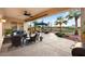 Inviting covered patio with comfortable seating, perfect for outdoor entertaining and relaxation at 22416 N Arrellaga Dr, Sun City West, AZ 85375