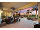 Covered patio featuring ample seating areas and providing beautiful views of the golf course at 22416 N Arrellaga Dr, Sun City West, AZ 85375