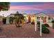 Beautiful home with well manicured desert landscaping, arched entryway, and a two-car garage at 22416 N Arrellaga Dr, Sun City West, AZ 85375