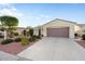 Well-maintained home with a spacious driveway and desert landscaping at 22416 N Arrellaga Dr, Sun City West, AZ 85375