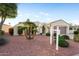 Attractive home with tidy desert landscaping, and arched gate entrance at 22416 N Arrellaga Dr, Sun City West, AZ 85375