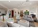 Comfortable living area with neutral furniture, fireplace, and a warm, inviting atmosphere at 22416 N Arrellaga Dr, Sun City West, AZ 85375