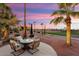 Outdoor seating area providing a relaxing atmosphere with beautiful twilight views of the golf course at 22416 N Arrellaga Dr, Sun City West, AZ 85375