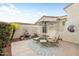 Relaxing patio featuring comfortable seating and a shaded umbrella at 22416 N Arrellaga Dr, Sun City West, AZ 85375