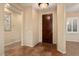 Entryway with neutral walls, tile flooring and a dark wood door at 22515 N Arrellaga Dr, Sun City West, AZ 85375