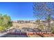 Relax in this backyard with community views, a grass area and mature trees at 2325 S 88Th Dr, Tolleson, AZ 85353