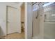 Clean bathroom featuring a glass shower enclosure and a view of the toilet area at 2325 S 88Th Dr, Tolleson, AZ 85353