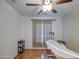 Bright room with light floors, a white examination table, and sliding glass doors at 2325 S 88Th Dr, Tolleson, AZ 85353