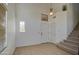 Bright entryway with neutral tile flooring, staircase and windows offering an inviting space at 2325 S 88Th Dr, Tolleson, AZ 85353