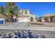 Attractive two-story home showcasing desert landscaping, a concrete driveway, and a two-car garage at 2325 S 88Th Dr, Tolleson, AZ 85353