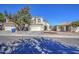 Inviting two-story home with a well-maintained lawn and a spacious driveway leading to a two-car garage at 2325 S 88Th Dr, Tolleson, AZ 85353