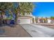 Charming two-story home featuring a low maintenance desert landscape and a large shade tree at 2325 S 88Th Dr, Tolleson, AZ 85353