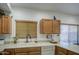 The Kitchen features wooden cabinets, stainless steel appliances, and lots of counter space and sink at 2325 S 88Th Dr, Tolleson, AZ 85353