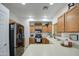 The Kitchen features wooden cabinets, stainless steel appliances, and lots of counter space at 2325 S 88Th Dr, Tolleson, AZ 85353
