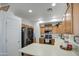 The Kitchen features wooden cabinets, stainless steel appliances, a breakfast bar and lots of counter space at 2325 S 88Th Dr, Tolleson, AZ 85353