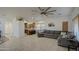 Cozy living room seamlessly blends with the kitchen, providing an open and inviting space for relaxation and entertainment at 2325 S 88Th Dr, Tolleson, AZ 85353