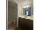 Bathroom featuring a vanity with a white countertop and dark brown cabinets at 2625 E Indian School Rd # 335, Phoenix, AZ 85016